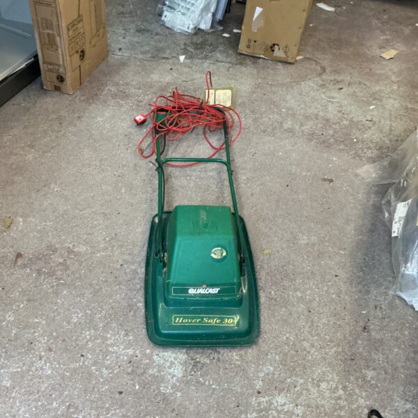Vintage Qualcast hover mower in used condition.