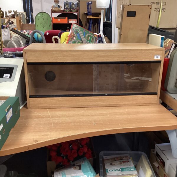Rectangular vivarium with glass panels and wooden frame.