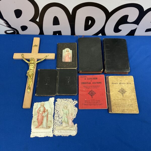 Vintage religious prayer books and crucifix collection.