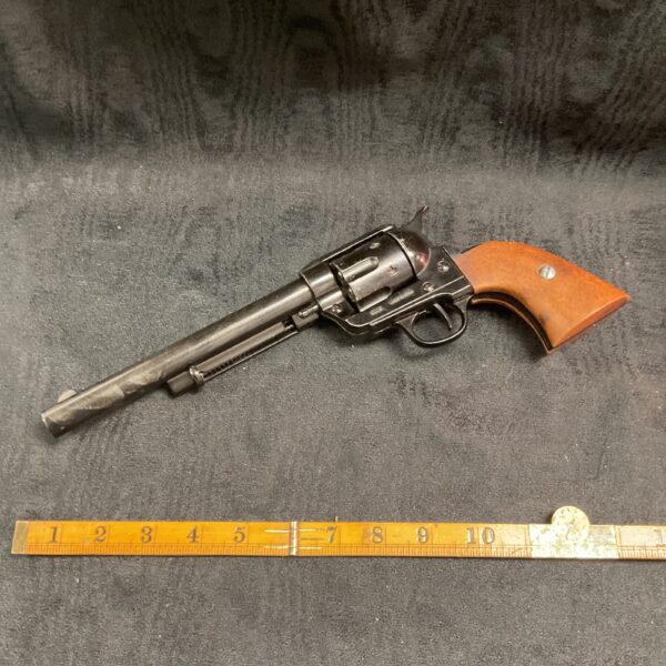 Detailed replica Colt 45 long barrel pistol for collectors.