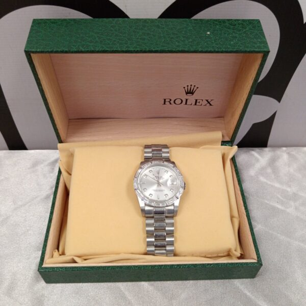 Silver replica designer watch in a fitted box.