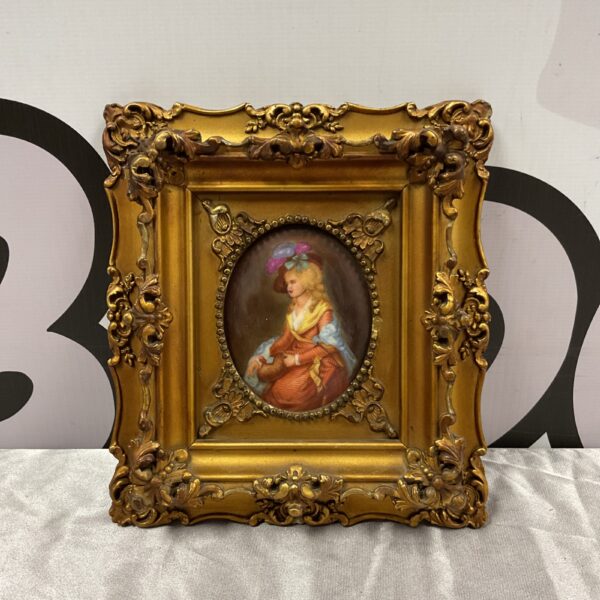 Antique rococo miniature portrait on porcelain with ornate frame.