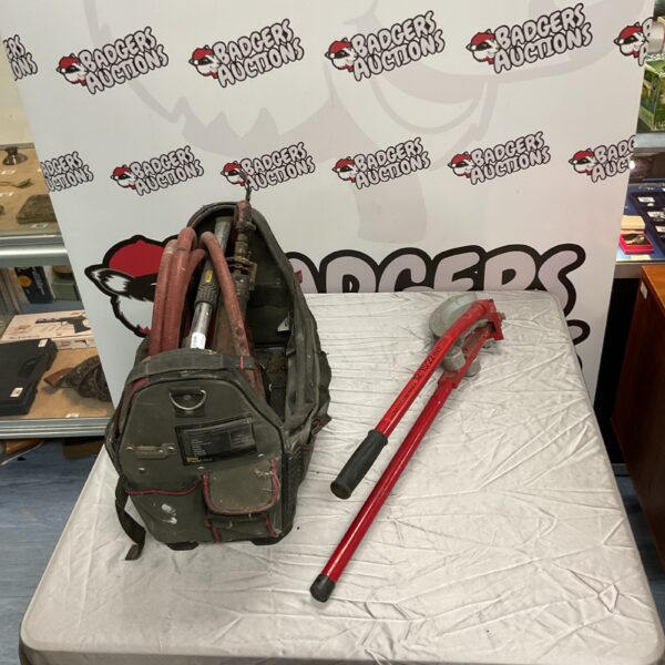 Rothenberger pipe bender and Stanley FatMax tool bag for plumbing.