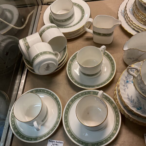 Vintage Royal Doulton coffee set with floral design on display.