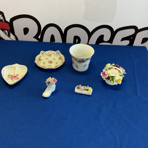 Royal Doulton miniature flowers in a vintage porcelain display.