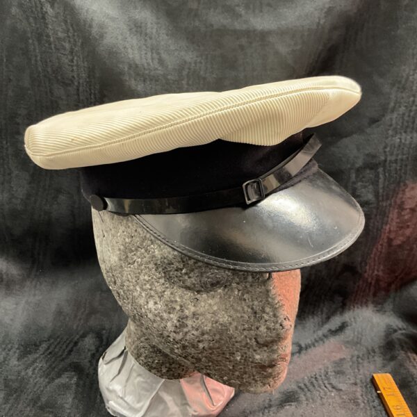 Vintage Royal Navy peaked cap, front view.