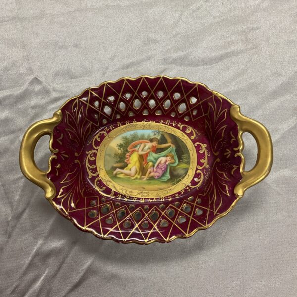 Antique Royal Vienna pierced porcelain basket with intricate detail.