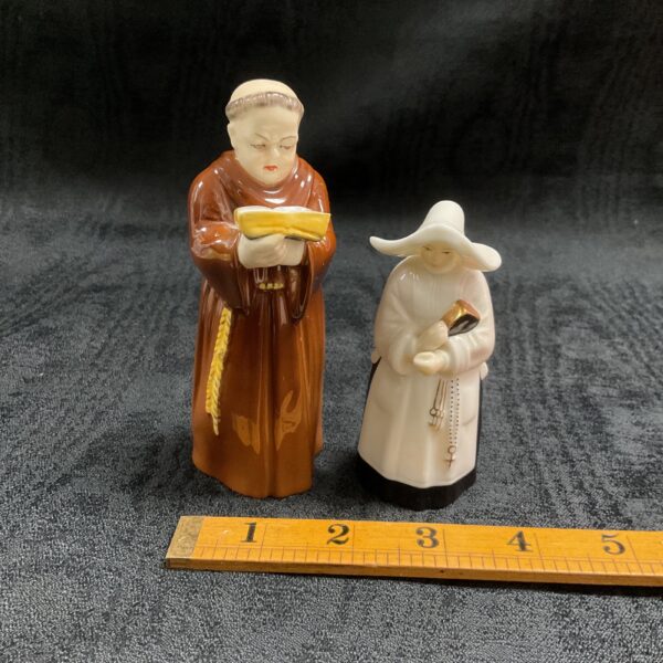 Vintage Royal Worcester monk and nun candle snuffers, porcelain figures.