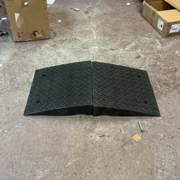 Durable rubber threshold ramp for vehicle and curb access.