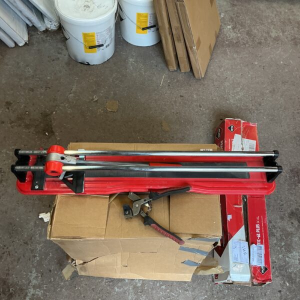 Rubi tile cutting set with buckets for DIY tiling projects.
