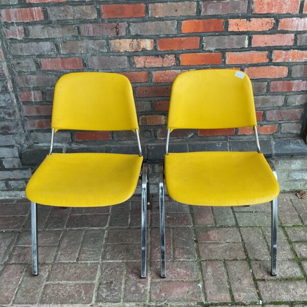 Vintage Samsonite chairs in mustard yellow with chrome legs.