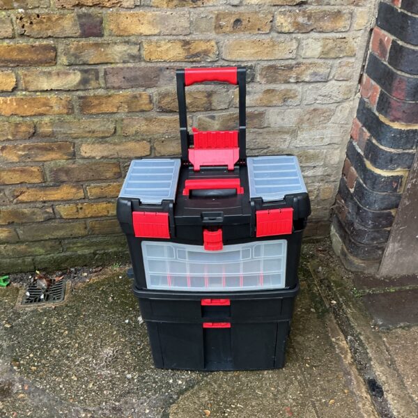 Front view of a black and red Sealey tool trolley.