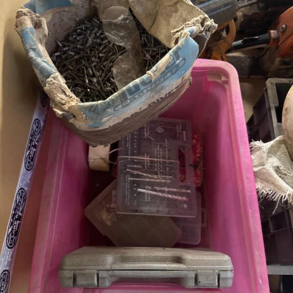 Assorted nails and rivets in a shed clearance lot for DIY projects.
