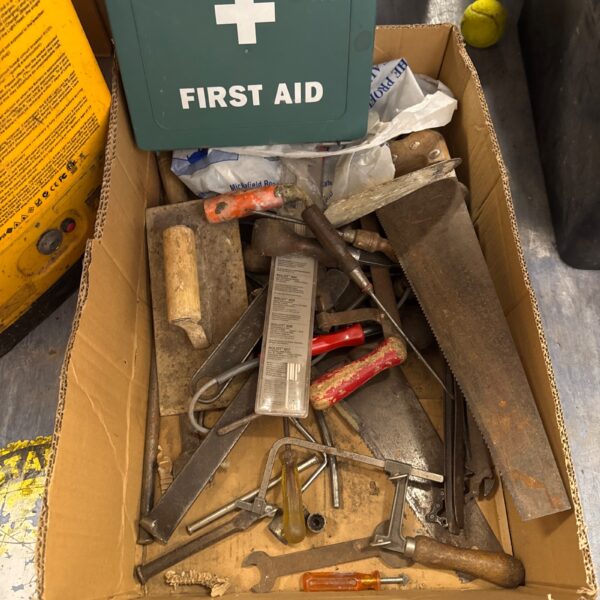 Mixed lot of shed clearance tools and a first aid kit.