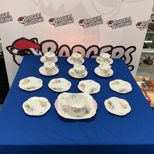 Vintage Shelly tea set with wild flower pattern on display.