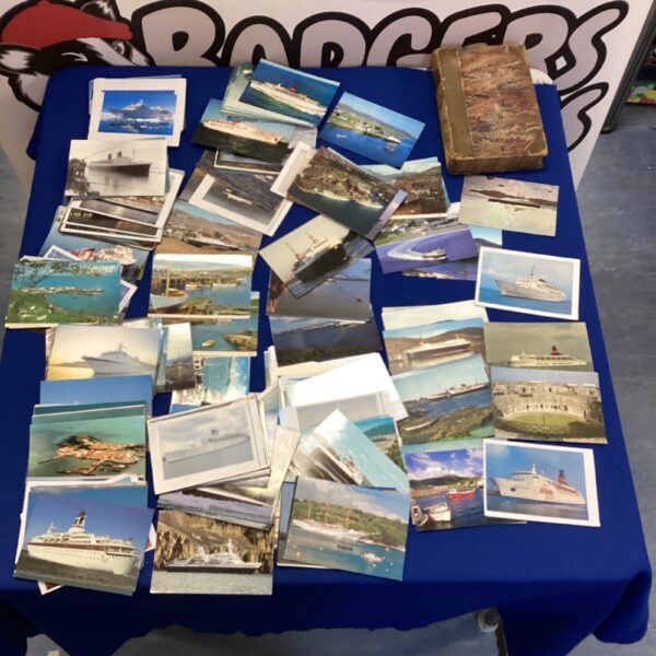 Vintage shipping postcards depicting various ships and maritime scenes.