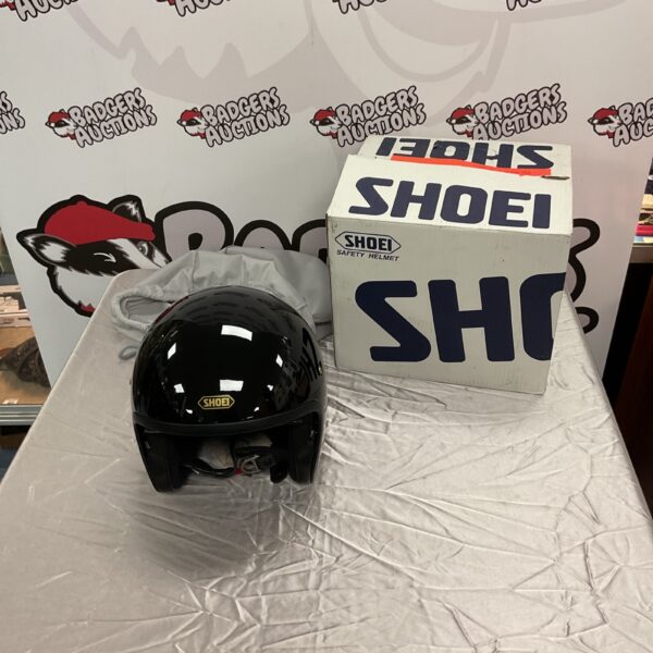 Black Shoei XXL safety helmet for motorcycle riding.