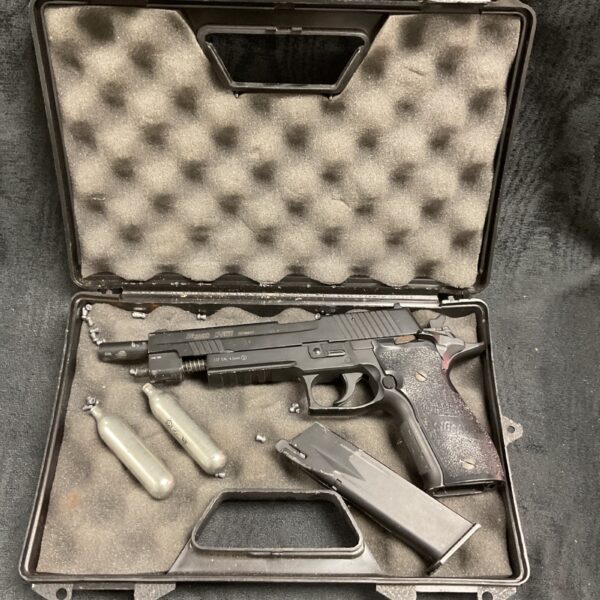 Sig Sauer X5 air pistol replica in open case.
