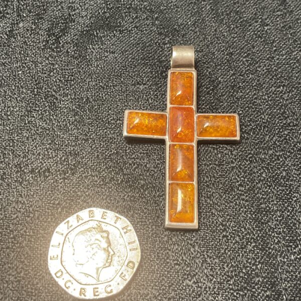 Vintage silver cross pendant with amber inlay.