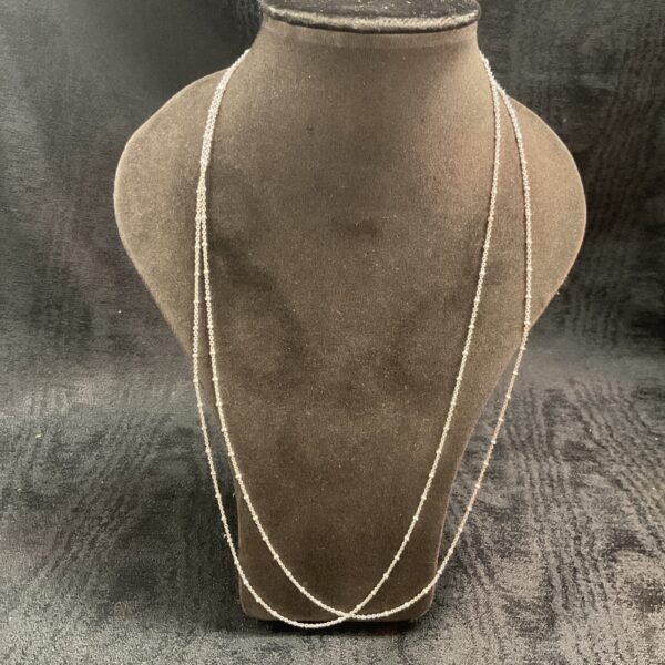 Two delicate 925 silver ball chain necklaces on display.