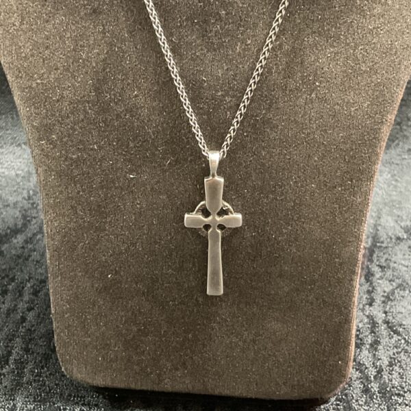 Silver Celtic cross pendant on 18 inch chain, detailed knotwork.