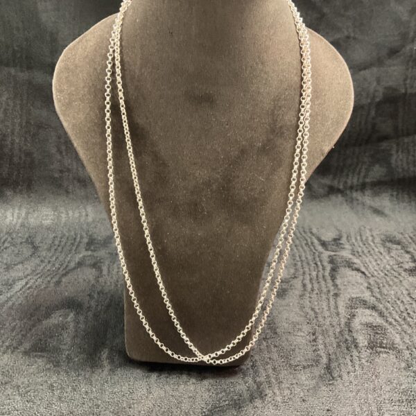 Pair of delicate 925 silver chain necklaces on a display bust.
