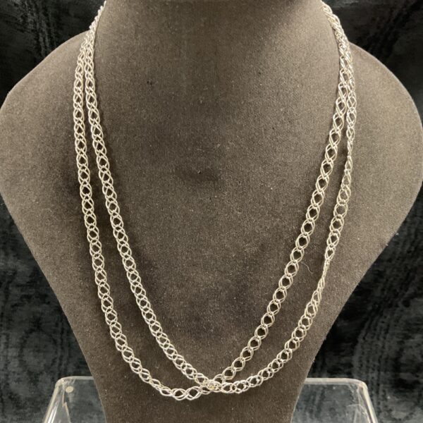 Two 925 silver double link necklaces on a display bust.