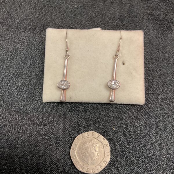 Silver drop earrings with a white stone setting, elegant fashion jewellery.