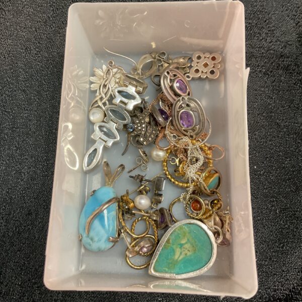 Mixed lot of silver jewellery with colourful accents.