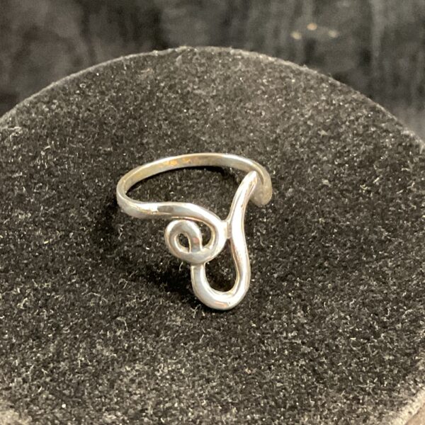 Silver spiral ring size R, a modern fashion accessory.