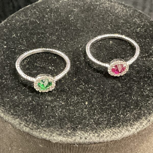 Silver ring set with red and green stones, fashion jewellery.