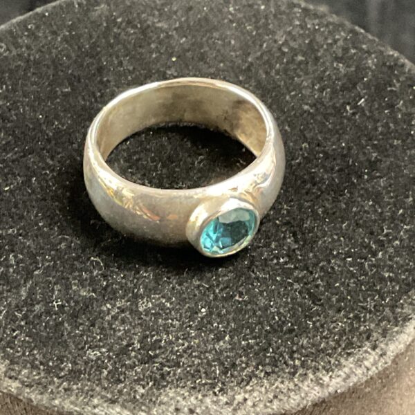 Vibrant blue topaz set in a 925 silver ring.