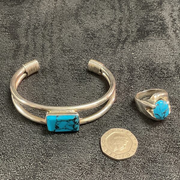 Silver bracelet and ring set with natural turquoise stones.