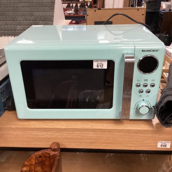 White Silvercrest microwave oven on a countertop.