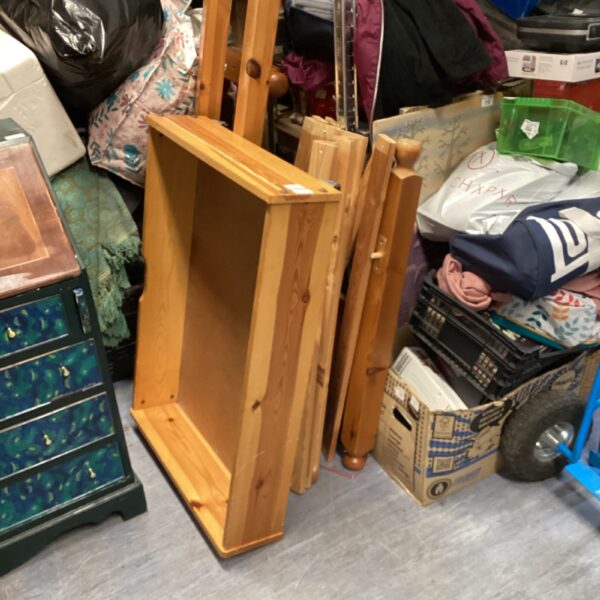 Vintage single pine bed frame with mattress and drawer.