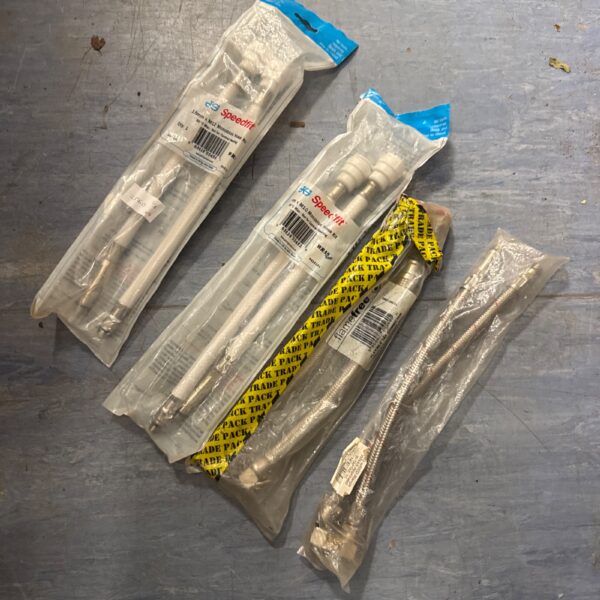 New sink tap tails kits including Speedfit, sealed in packaging.