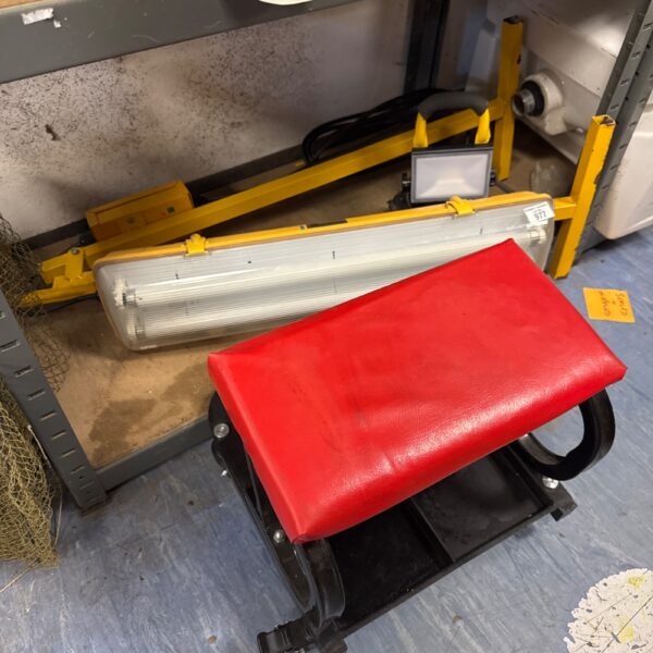 Site lights and workshop stool lot for construction or garage use.