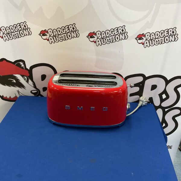 Vibrant red Smeg toaster, a retro kitchen appliance.