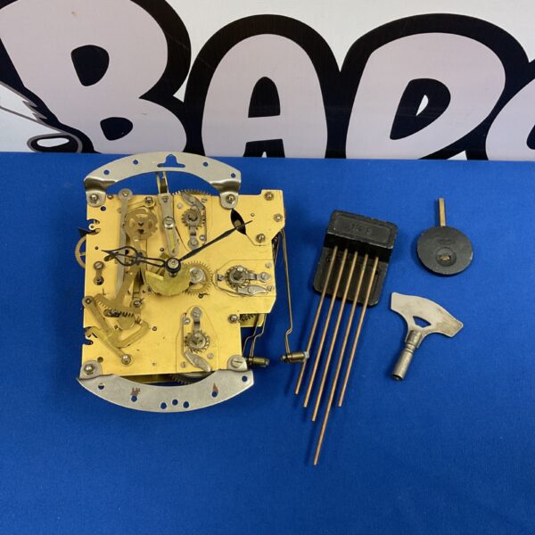Antique Smiths Enfield Westminster chime clock movement with key.