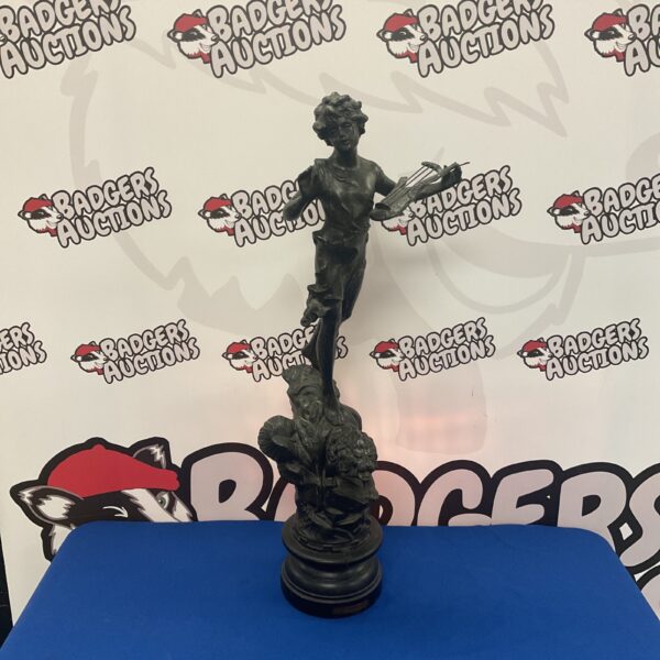 Vintage spelter La Musique sculpture on a lion base, Art Deco style.