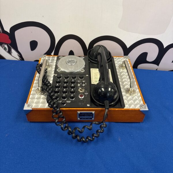 Reproduction Spirit of St Louis telephone on a dark surface.