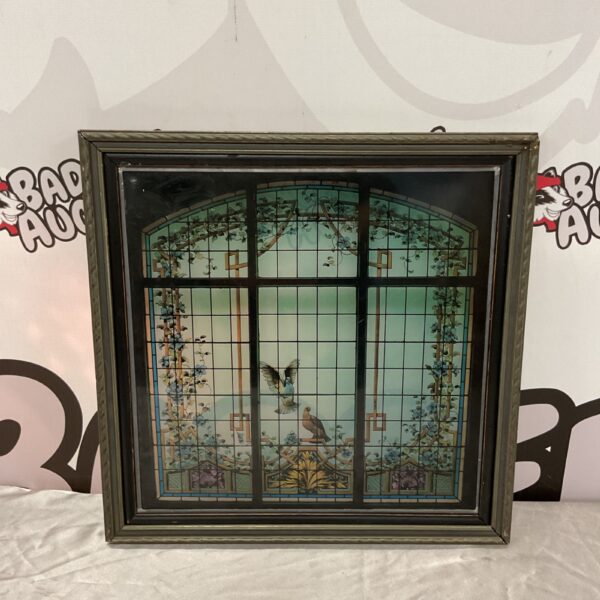 Vintage stained glass window study with bird motif and leadwork.