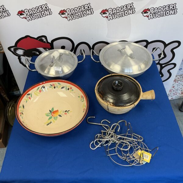 Stainless steel kitchenware set with dishes, bowl, and hooks.