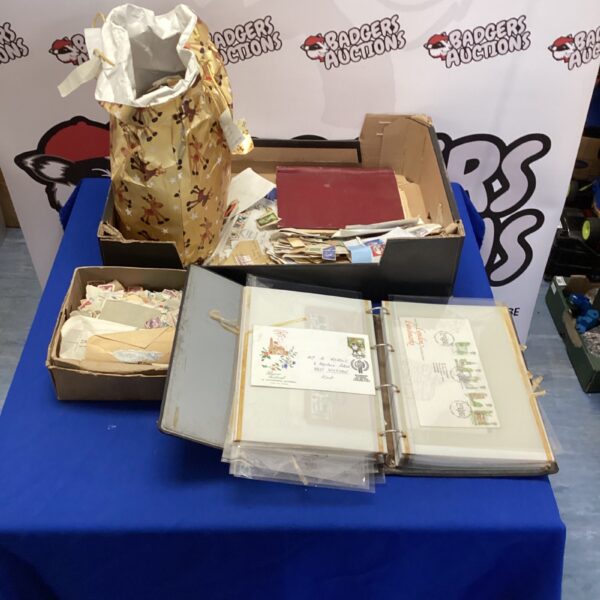 Vintage stamp collection with first day covers in a binder.