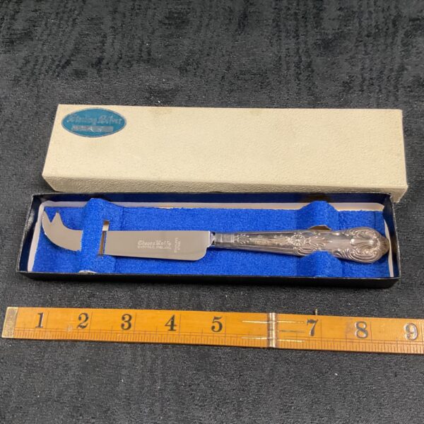 Vintage sterling silver cheese knife in presentation box.