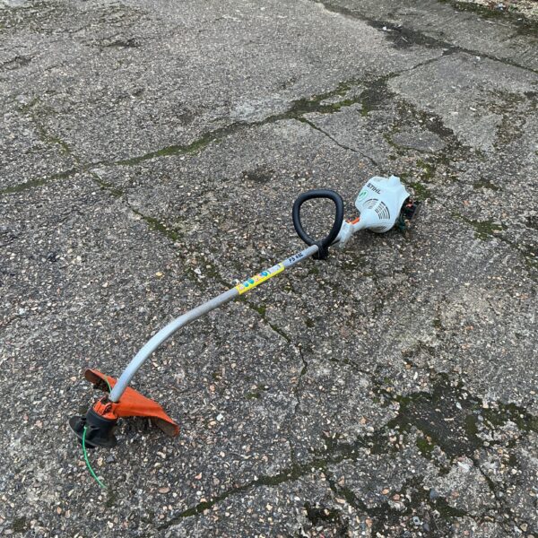 Used Stihl FS4 SC petrol strimmer for garden maintenance.