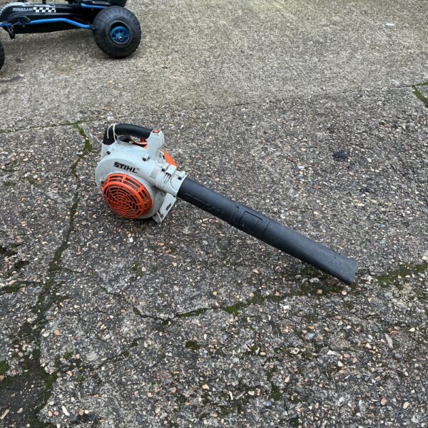Used Stihl petrol leaf blower for garden clearing.