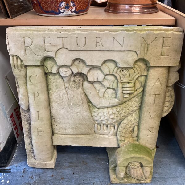 Large stone garden beast carving, a weathered mythical creature ornament.