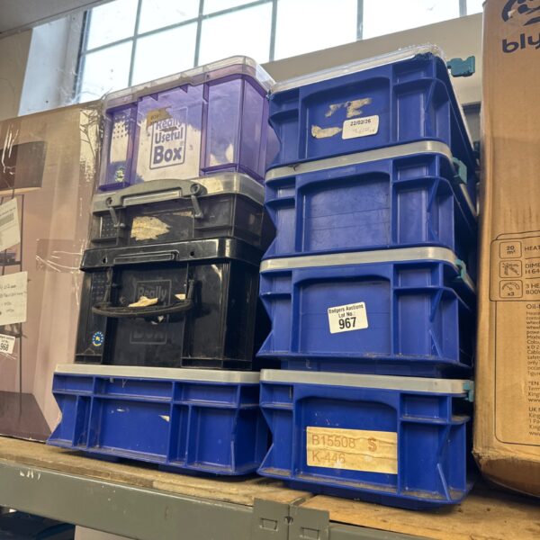 Blue plastic storage boxes from Really Useful and other brands.