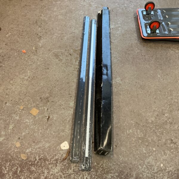 Metal straight edge cutter for precise measuring and layout.